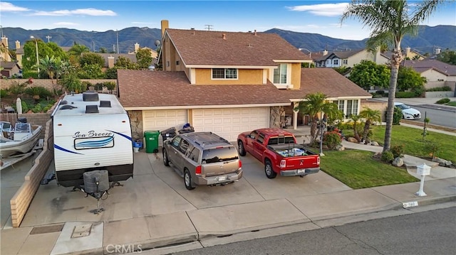 1142 Daisy Cir, Corona, CA 92882 - traditional home with a mountain view, concrete driveway, stucco siding, a residential view, and an attached garage
