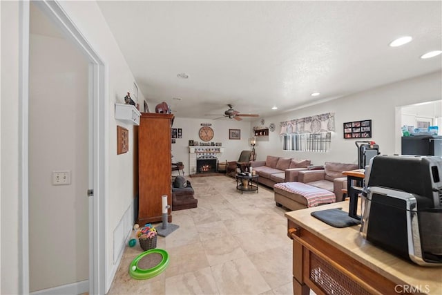 1142 Daisy Cir, Corona, CA 92882 - living area featuring ceiling fan, recessed lighting, and a lit fireplace