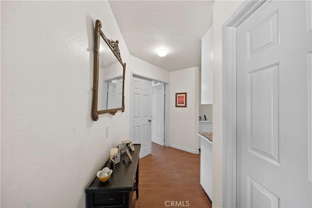 1142 Daisy Cir, Corona, CA 92882 - corridor with dark wood-type flooring and a textured ceiling