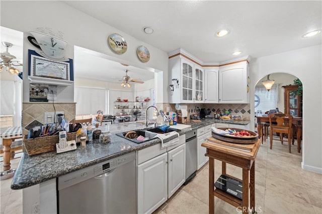 1142 Daisy Cir, Corona, CA 92882 - kitchen featuring stainless steel dishwasher, a ceiling fan, glass insert cabinets, decorative backsplash, and recessed lighting