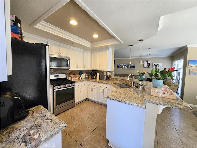 25632 Salerno Way, Yorba Linda, CA 92887 - kitchen featuring stainless steel appliances, a peninsula, light tile patterned flooring, ornamental molding, and backsplash