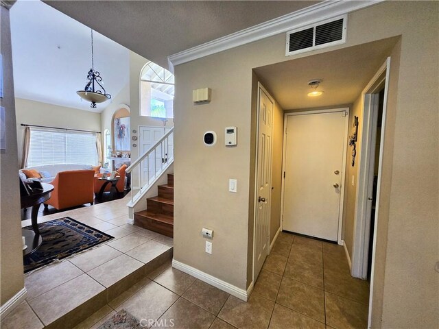 25632 Salerno Way, Yorba Linda, CA 92887 - entrance foyer featuring tile patterned floors, ornamental molding, stairway, and arched walkways