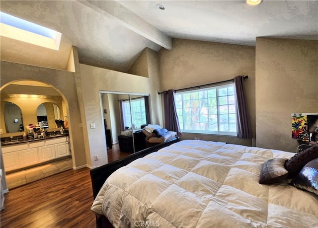 25632 Salerno Way, Yorba Linda, CA 92887 - bedroom with arched walkways, dark wood finished floors, beamed ceiling, connected bathroom, and high vaulted ceiling