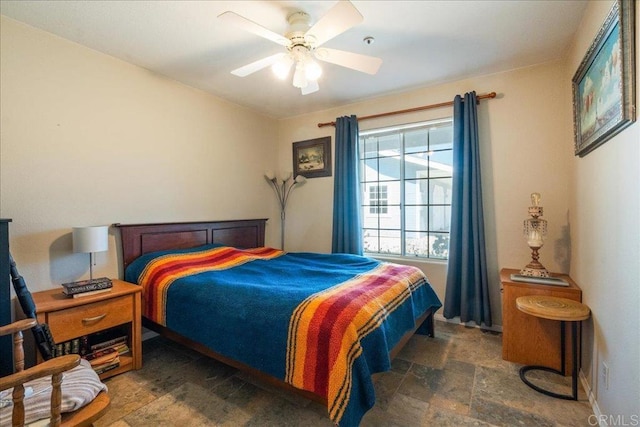 772 Rainbow Crest Rd, Fallbrook, CA 92028 - bedroom with stone finish flooring and a ceiling fan