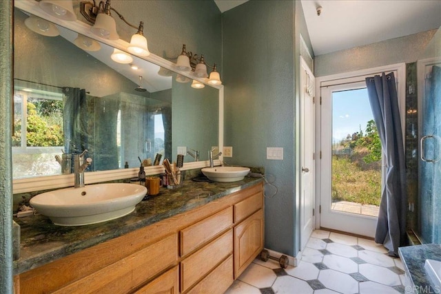 772 Rainbow Crest Rd, Fallbrook, CA 92028 - full bathroom featuring plenty of natural light, a stall shower, tile patterned floors, double vanity, and a textured wall