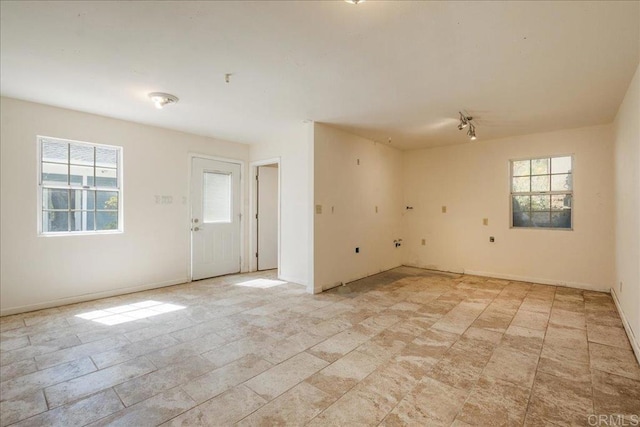 772 Rainbow Crest Rd, Fallbrook, CA 92028 - unfurnished room featuring baseboards and light stone finish floors