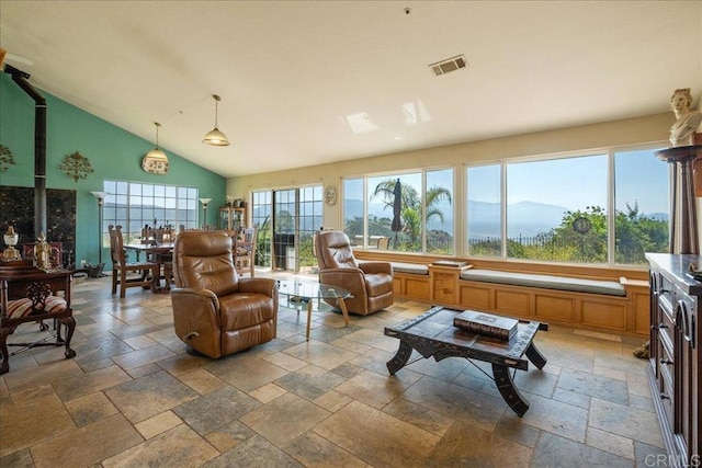 772 Rainbow Crest Rd, Fallbrook, CA 92028 - living area featuring stone tile flooring, high vaulted ceiling, and a mountain view