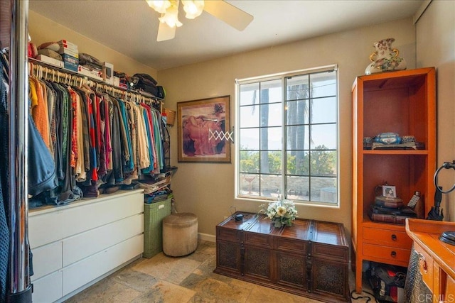 772 Rainbow Crest Rd, Fallbrook, CA 92028 - spacious closet with ceiling fan and stone finish flooring