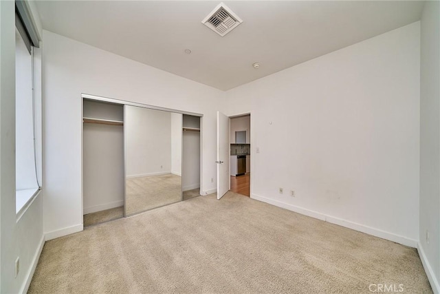 3810 Wilshire Blvd Unit 805, Los Angeles, CA 90010 - unfurnished bedroom featuring light carpet and a closet