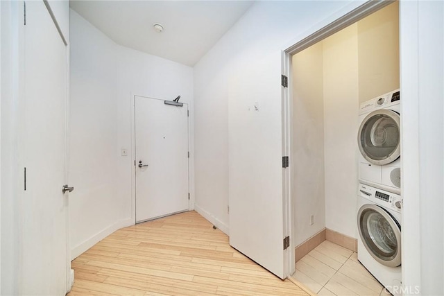 3810 Wilshire Blvd Unit 805, Los Angeles, CA 90010 - laundry room featuring stacked washer / dryer and light wood-style flooring