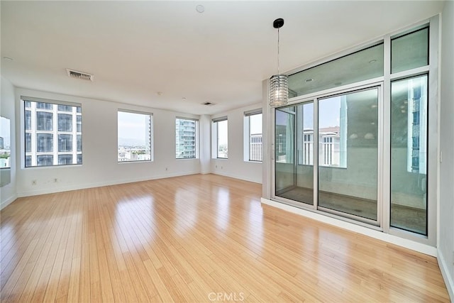3810 Wilshire Blvd Unit 805, Los Angeles, CA 90010 - spare room featuring light wood-style flooring and baseboards