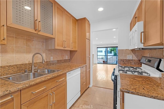 7505 Hampton Ave Unit 8, West Hollywood, CA 90046 - kitchen with white appliances, glass insert cabinets, backsplash, recessed lighting, and light stone countertops