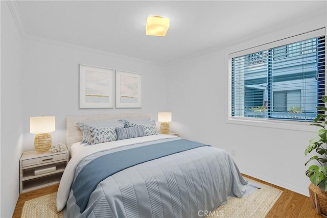 7505 Hampton Ave Unit 8, West Hollywood, CA 90046 - bedroom featuring wood finished floors and ornamental molding