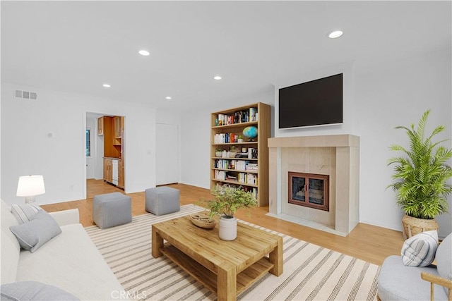 7505 Hampton Ave Unit 8, West Hollywood, CA 90046 - living room featuring recessed lighting, a fireplace, and light wood-style flooring
