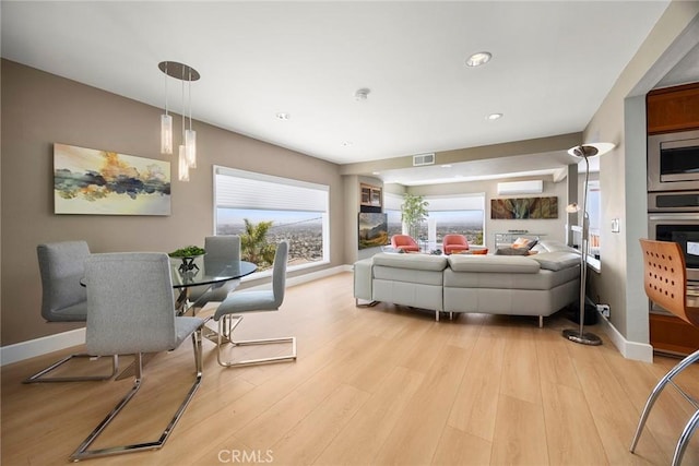 12281 Alta Panorama, North Tustin, CA 92705 - living room featuring a wall mounted air conditioner, light wood-style floors, and recessed lighting