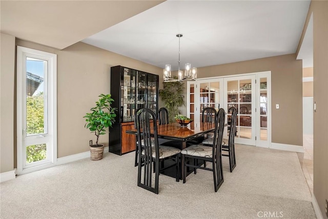 12281 Alta Panorama, North Tustin, CA 92705 - dining space with a chandelier, french doors, plenty of natural light, and light carpet