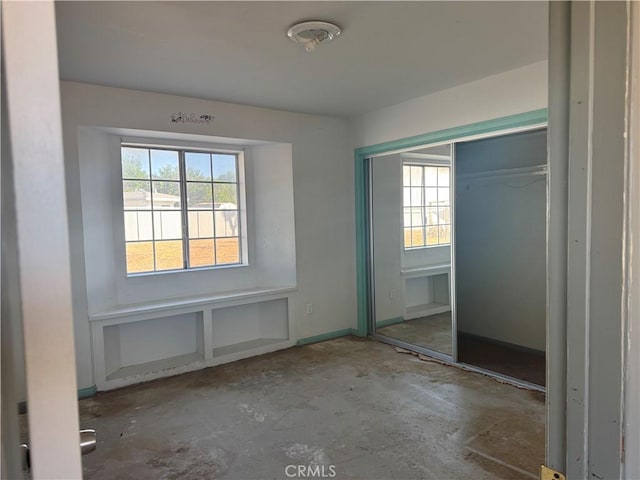 20635 Tonawanda Rd, Apple Valley, CA 92307 - unfurnished bedroom featuring concrete floors and a closet