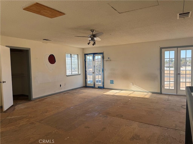 20635 Tonawanda Rd, Apple Valley, CA 92307 - spare room with a textured ceiling, ceiling fan, and french doors