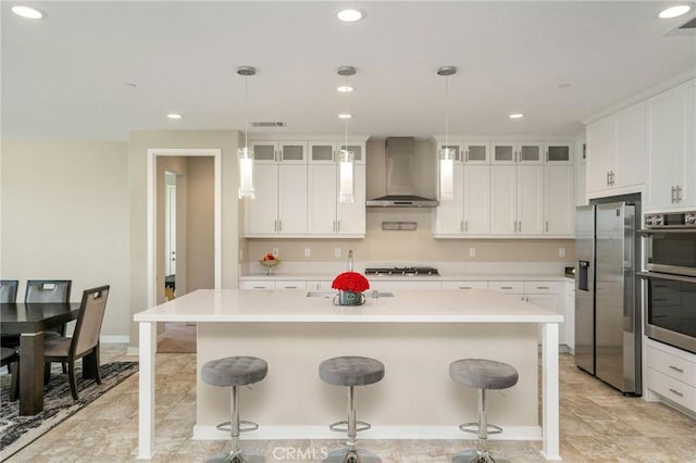 28511 Sparrow Way, Saugus, CA 91350 - kitchen featuring stainless steel appliances, wall chimney range hood, a center island with sink, light countertops, and recessed lighting