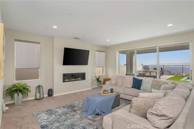 28511 Sparrow Way, Saugus, CA 91350 - carpeted living area featuring a glass covered fireplace and recessed lighting