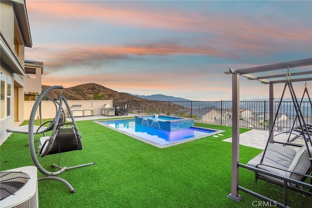 28511 Sparrow Way, Saugus, CA 91350 - pool at dusk featuring a mountain view, a fenced backyard, a patio, and a pool with connected hot tub