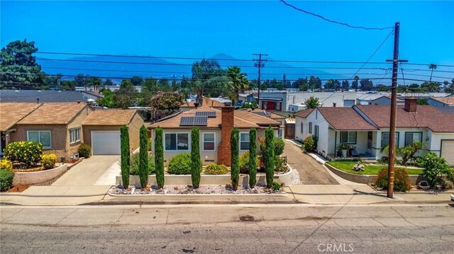 2685 Arrow Hwy, La Verne, CA 91750 - single story home featuring a residential view, concrete driveway, solar panels, and an attached garage