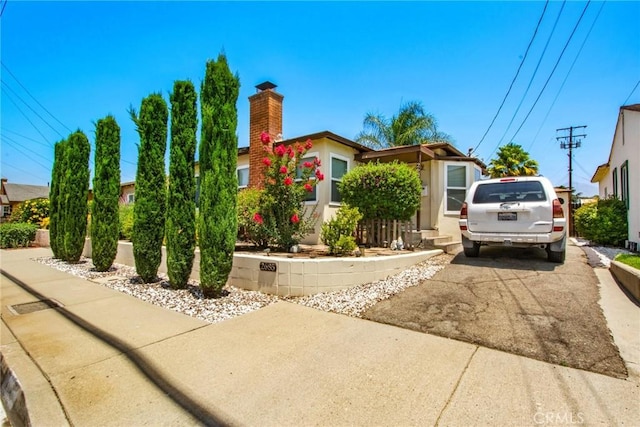 2685 Arrow Hwy, La Verne, CA 91750 - view of front of property with a chimney and stucco siding