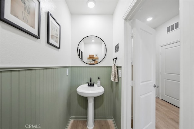 1060 Kendale Way, Vista, CA 92081 - bathroom featuring wood finished floors and wainscoting