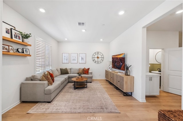 1060 Kendale Way, Vista, CA 92081 - living room with light wood finished floors and recessed lighting
