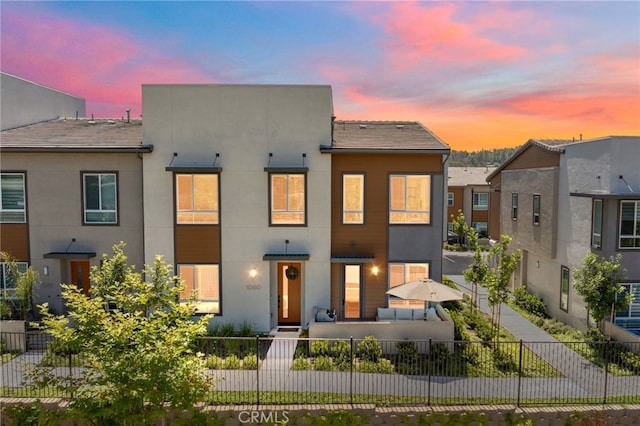 1060 Kendale Way, Vista, CA 92081 - rear view of property featuring a fenced front yard and stucco siding