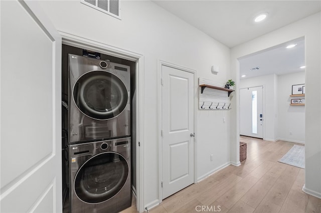 1060 Kendale Way, Vista, CA 92081 - laundry area featuring stacked washing machine and dryer, light wood-type flooring, and recessed lighting