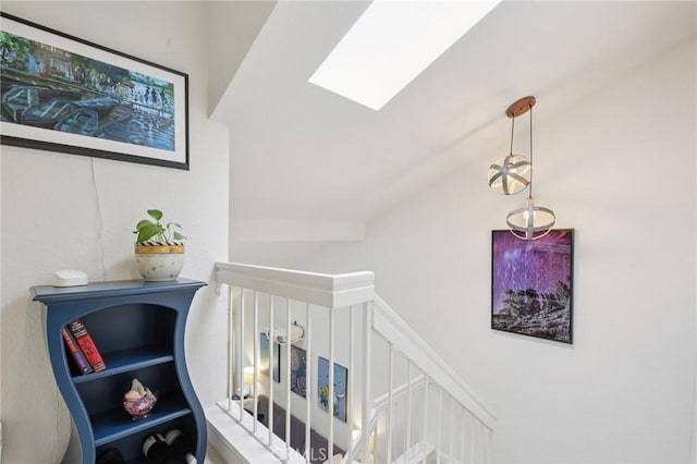 306 San Nicholas Ct, Laguna Beach, CA 92651 - stairs with a skylight and vaulted ceiling