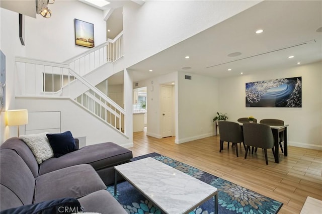 306 San Nicholas Ct, Laguna Beach, CA 92651 - living room featuring stairs, wood finished floors, and recessed lighting