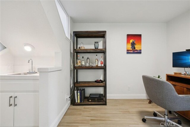 306 San Nicholas Ct, Laguna Beach, CA 92651 - office area with a sink and light wood-style flooring