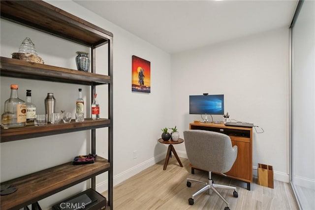 306 San Nicholas Ct, Laguna Beach, CA 92651 - office area featuring light wood-style flooring and a bar
