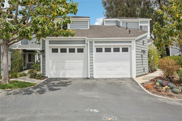 306 San Nicholas Ct, Laguna Beach, CA 92651 - view of front of property with an attached garage, driveway, and roof with shingles