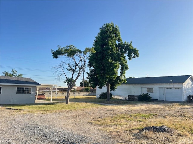 6910 Carnelian St, Rancho Cucamonga, CA 91701 - view of front of house featuring dirt driveway and an attached garage