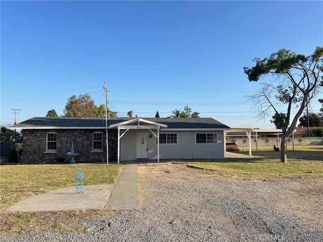 6910 Carnelian St, Rancho Cucamonga, CA 91701 - ranch-style home with a front lawn and stone siding