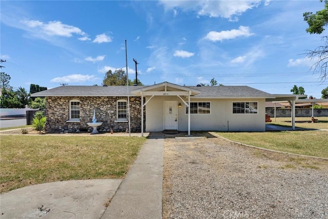 6910 Carnelian St, Rancho Cucamonga, CA 91701 - ranch-style house featuring a front lawn, stucco siding, and stone siding