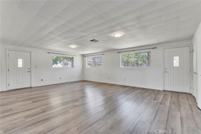 6910 Carnelian St, Rancho Cucamonga, CA 91701 - foyer featuring healthy amount of natural light and light wood-style flooring