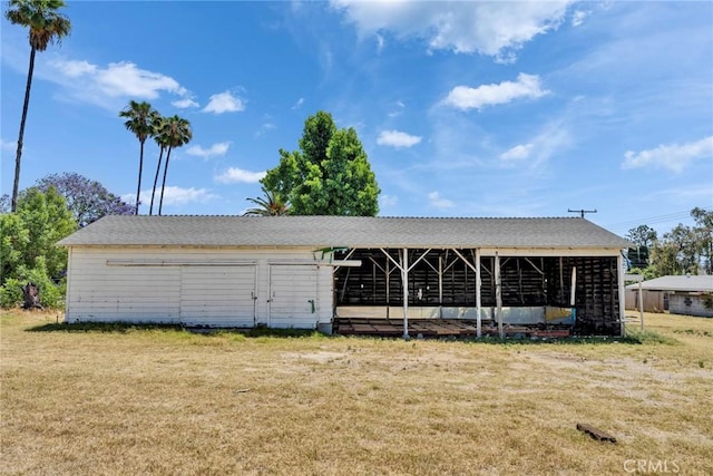 6910 Carnelian St, Rancho Cucamonga, CA 91701 - view of front of house with a front lawn and an outbuilding