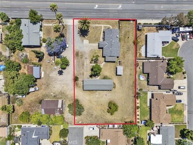 6910 Carnelian St, Rancho Cucamonga, CA 91701 - aerial perspective of suburban area featuring property parcel outlined