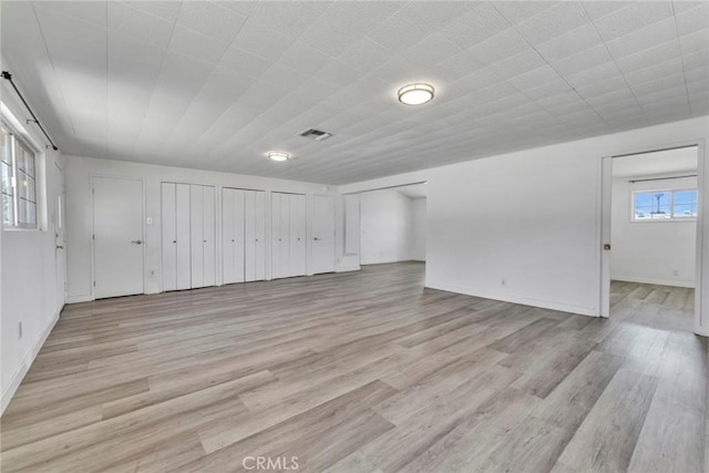 6910 Carnelian St, Rancho Cucamonga, CA 91701 - unfurnished living room with light wood finished floors and baseboards
