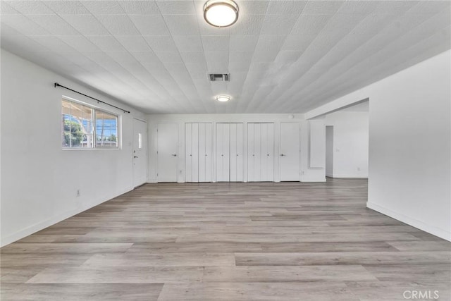 6910 Carnelian St, Rancho Cucamonga, CA 91701 - unfurnished room with wood finished floors and baseboards