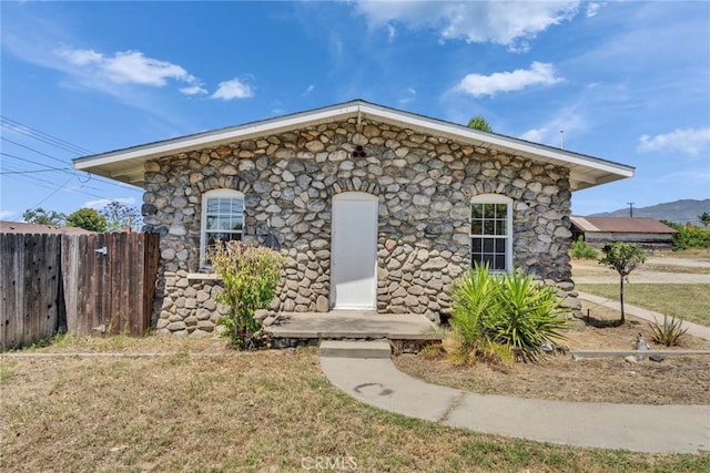 6910 Carnelian St, Rancho Cucamonga, CA 91701 - view of front of home featuring stone siding