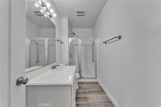 6910 Carnelian St, Rancho Cucamonga, CA 91701 - full bath featuring a shower stall, vanity, and wood finished floors