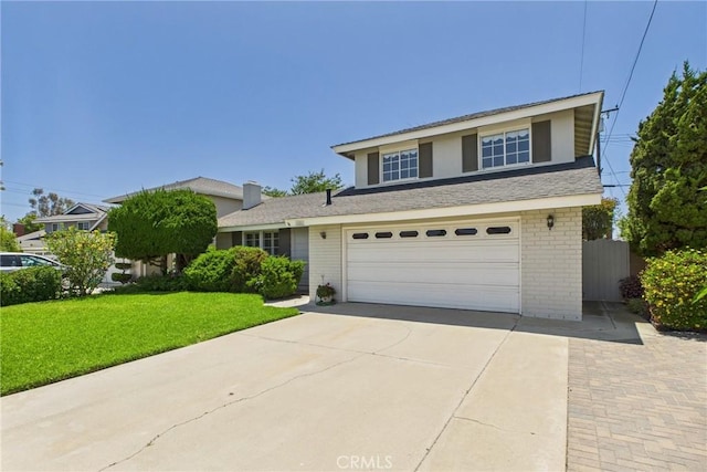 10469 Gregory Cir, Cypress, CA 90630 - view of front facade featuring driveway, brick siding, and a garage