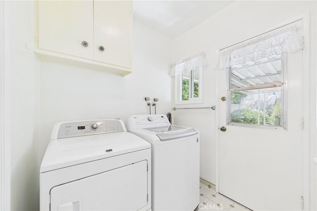 10469 Gregory Cir, Cypress, CA 90630 - laundry area with washer and dryer, cabinet space, and light tile patterned floors