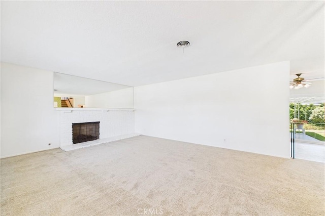10469 Gregory Cir, Cypress, CA 90630 - unfurnished living room featuring carpet, a fireplace, and ceiling fan