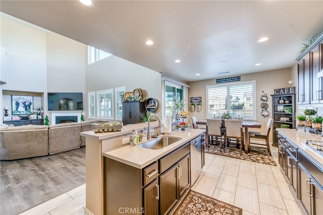 14655 Spanish Bay Way, Chowchilla, CA 93610 - kitchen featuring light countertops, stainless steel dishwasher, recessed lighting, a center island with sink, and a textured ceiling